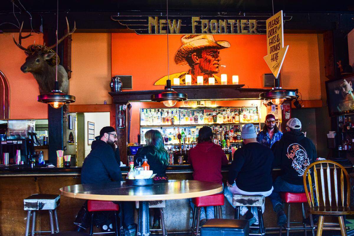 The bar, watched over by the Marlboro Man rescued from the original Cheney Stadium, is something of an industry secret. Bartender Kyle Busey chats with customers on Friday, May 26 before a show with the headliner Serpentfoot.