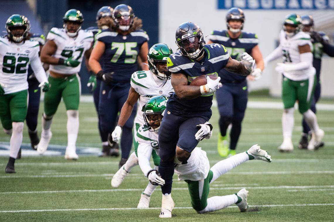 Seattle Seahawks running back Chris Carson rushes during the third quarter. The Seattle Seahawks played the New York Jets in a NFL football game at Lumen Field in Seattle, Wash., on Sunday, Dec. 13, 2020.