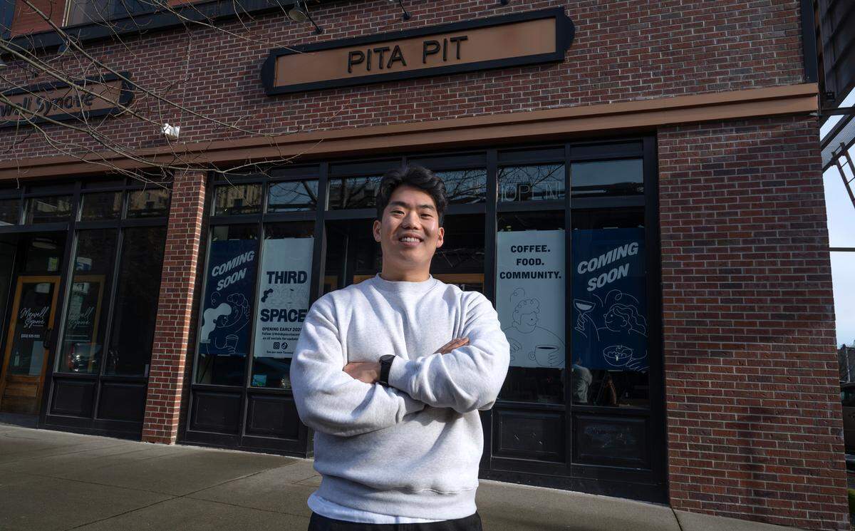 Kevin Lee outside his soon-to-open Third Space Cafe in the former Pita Pit in downtown Tacoma, Washington, on Monday, Dec. 23, 2024.