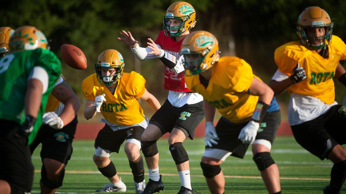 Tumwater junior quarterback Cody Whalen leads the T-Birds during football practice at Tumwater District Stadium on Wednesday, Nov. 6, 2019.