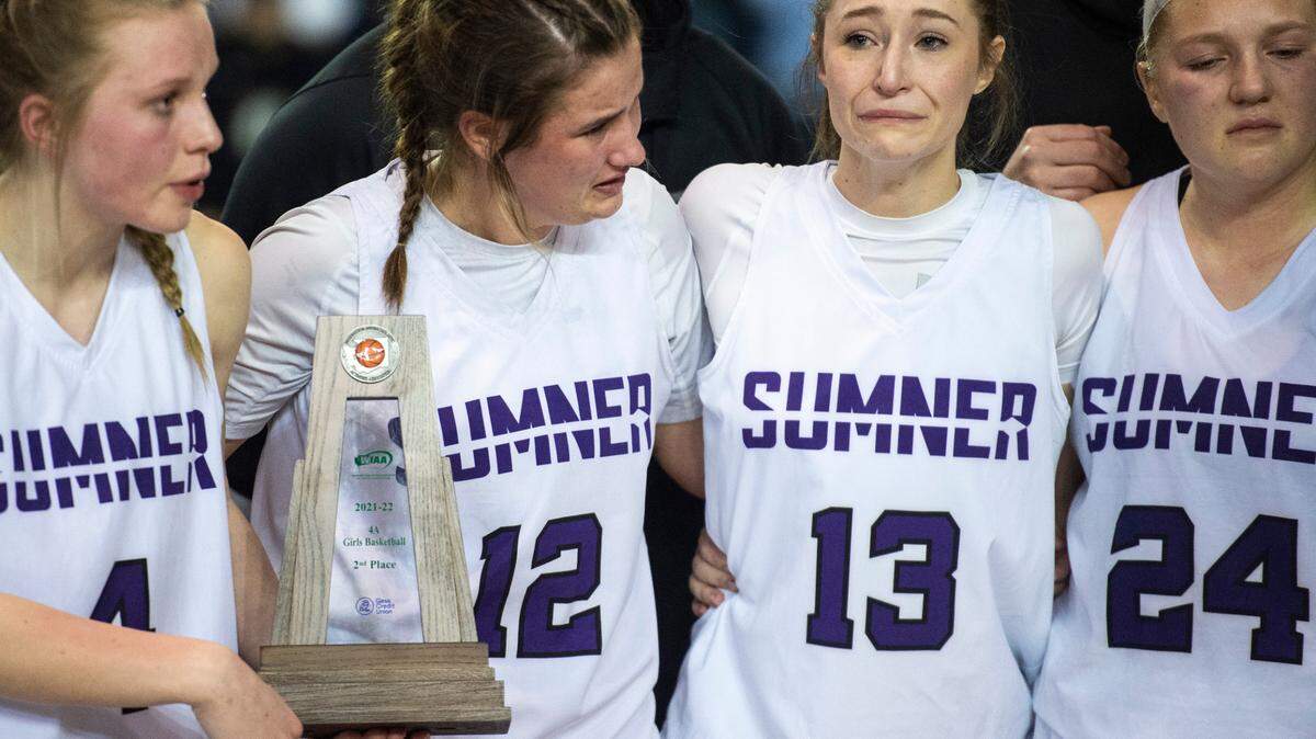 Sumner’s guard Jadey Parrott (12), guard Ella Olson (13) and guard Payton Martinson (24) become emotional after losing the 4A state championship game at Tacoma Dome in Tacoma, Wash. on Saturday, March 5, 2022.