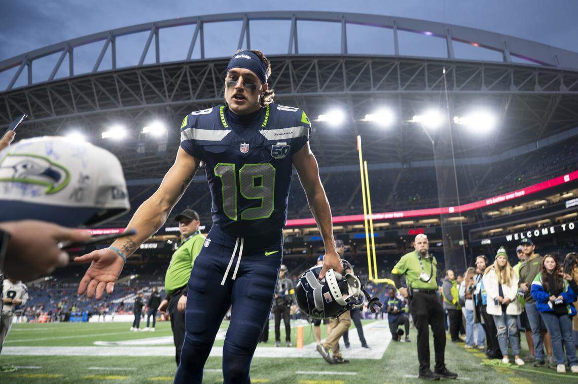 Seattle Seahawks wide receiver Jake Bobo (19) high-fives fans before the game against the Houston Texans at Lumen Field, on Monday, Oct. 20, 2025, in Seattle.