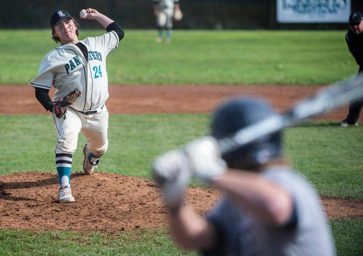 Bonney Lake High School varsity baseball pitcher Nic Lewandowski (24) pitches the ball during the district tournament game against Bainbridge at Bonney Lake High School in Bonney Lake, Wash. on Saturday, May 7, 2022.