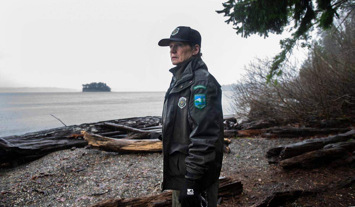 Park Ranger Shawn Douty stands on the beach at Kopachuck State Park in Gig Harbor, Washington, overlooking Cutts Island State Park in Carr Inlet, on Thursday, Jan. 6, 2022. The beach access will be redesigned to handle the thousands of visitors, including improved ADA-compatible access.