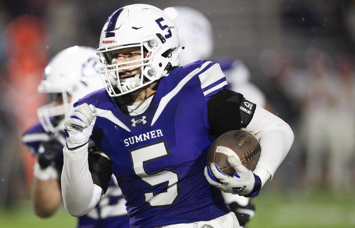 Sumner linebacker Austin Glivar (5) runs back a pick-6 against Eastmont during the first half of the game, at Sunset Chev Stadium on Friday, Nov. 7, 2025, in Sumner, Wash.