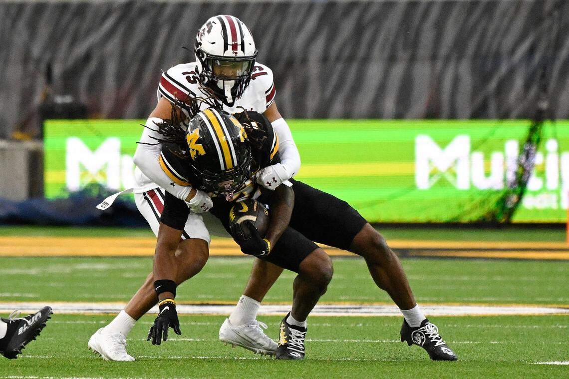 COLUMBIA, MISSOURI - SEPTEMBER 20: Brandon Cisse #15 of the South Carolina Gamecocks tackles Marquis Johnson #2 of the Missouri Tigers at Faurot Field at Memorial Stadium on September 20, 2025 in Columbia, Missouri. (Photo by Jeff Le/Getty Images)