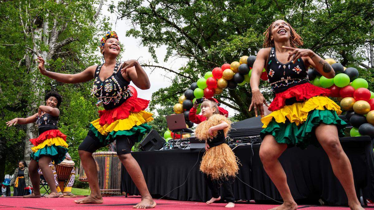 From left to right, Olivia Frieson, Sheimawu Abubakari, Sylvie Williams and Chelleea ChassionBashay with the Tacoma Performing Arts Center, dance on stage during the third annual Juneteenth celebration at Wright Park in Tacoma, Wash. on Saturday, June 18, 2022. This year’s celebration will take place at Stewart Heights Park.
