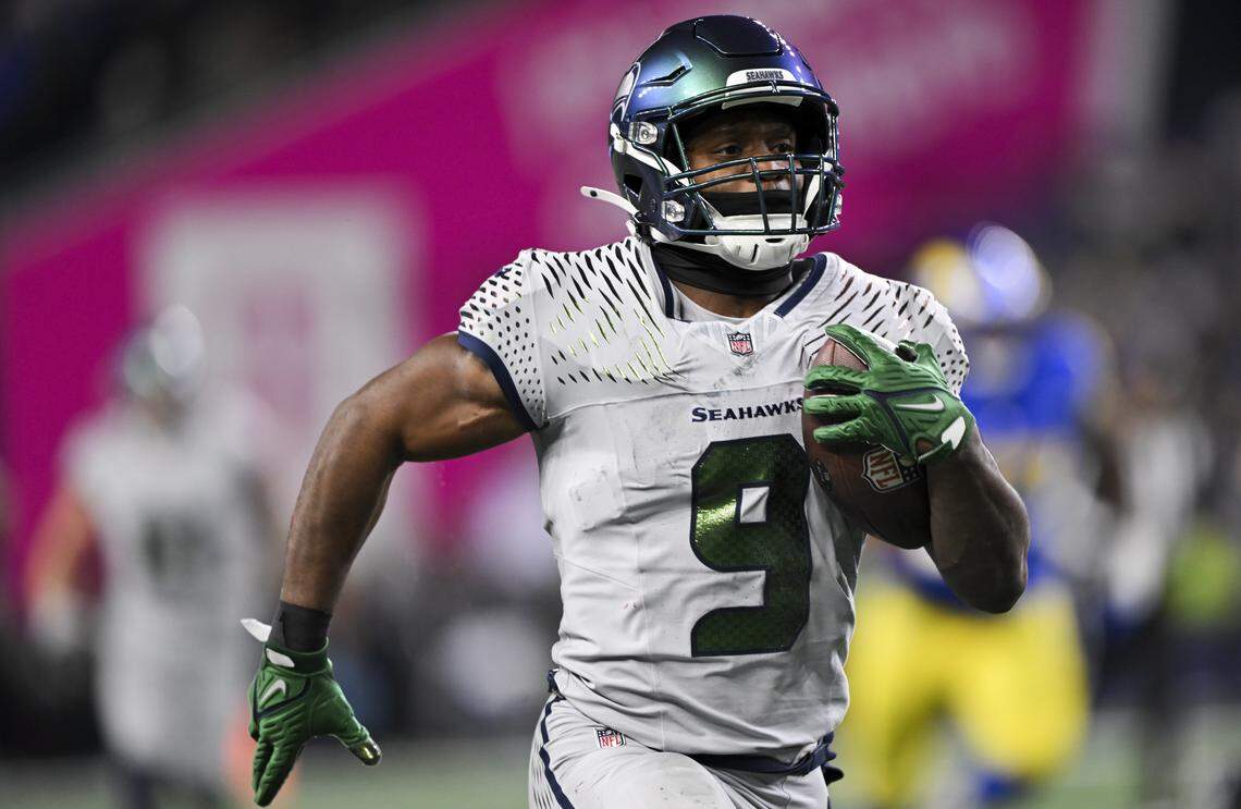 Seattle Seahawks running back Kenneth Walker III (9) runs in a 55-yard touchdown during the third quarter of the game against the Los Angeles Rams at Lumen Field, on Thursday, Dec. 18, 2025, in Seattle.