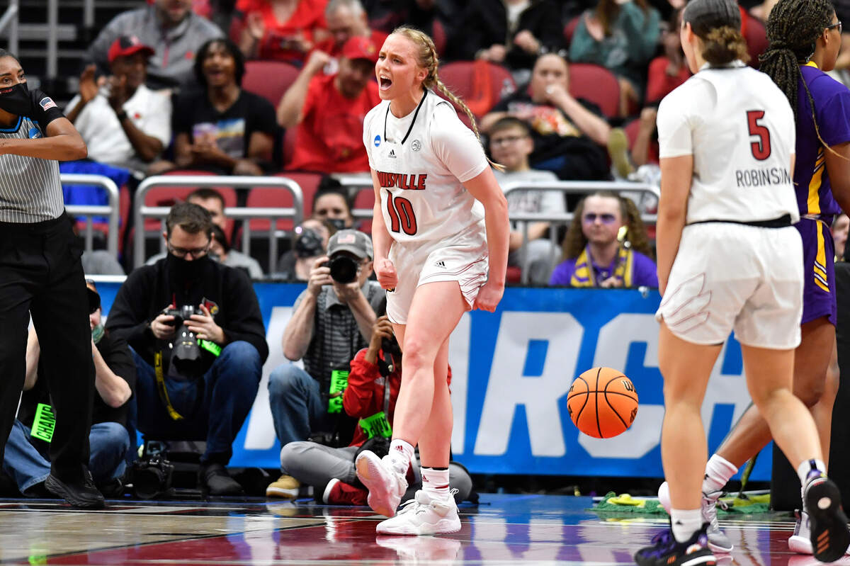 Louisville guard Hailey Van Lith (10) celebrates after scoring and getting fouled during the first half of their women’s NCAA Tournament college basketball first round game against Albany in Louisville, Ky., Friday, March 18, 2022. (AP Photo/Timothy D. Easley)