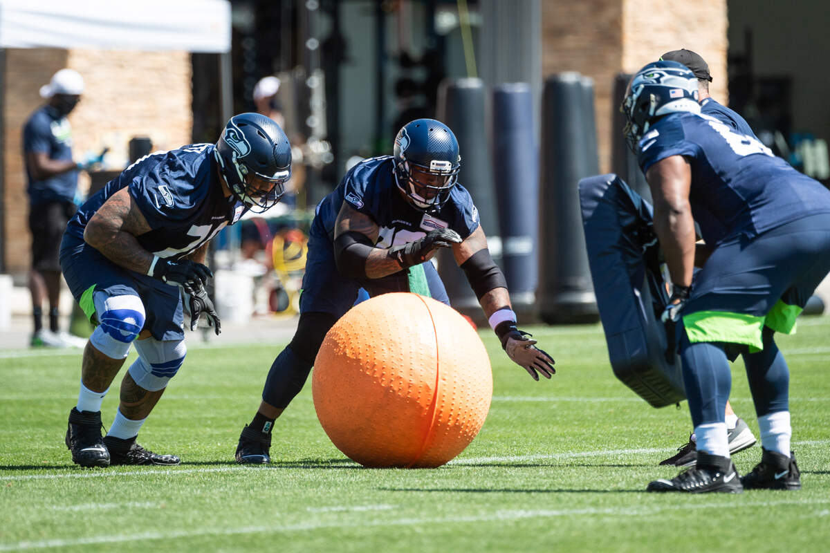 Seattle Seahawks offensive linemen Mike Iupati (70) and Duane Brown (76) during training camp practice at the Virginia Mason Athletic Center in Renton, WA on August 14, 2020. (MANDATORY CREDIT Ñ ROD MAR/SEATTLE SEAHAWKS)