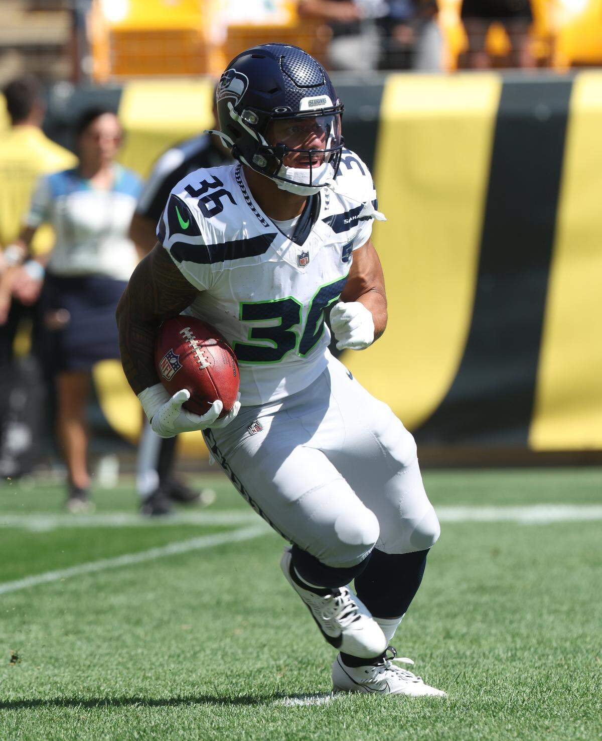Sep 14, 2025; Pittsburgh, Pennsylvania, USA; Seattle Seahawks running back George Holani (36) returns the opening kick-off against the Pittsburgh Steelers during the first quarter at Acrisure Stadium. Mandatory Credit: Charles LeClaire-Imagn Images
