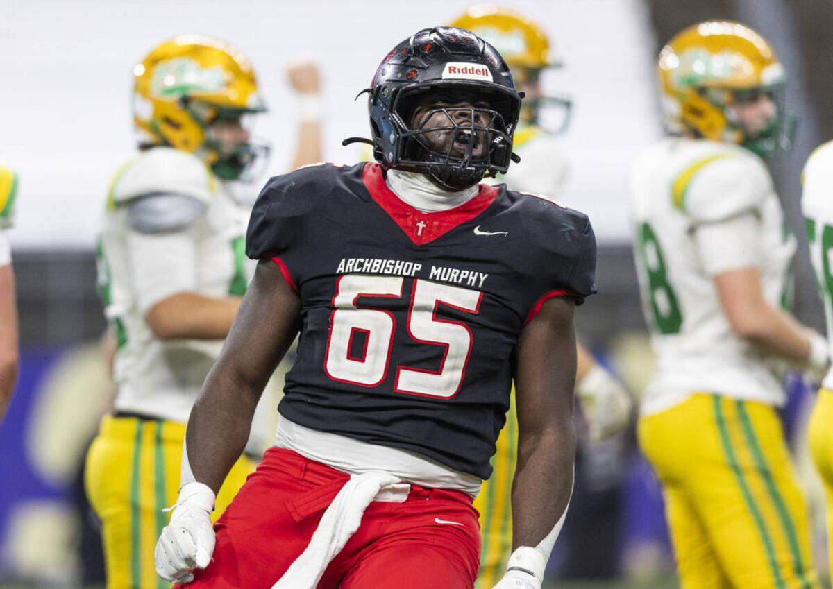 Archbishop Murphy’s Hakeim Smalls reacts to getting a stop on fourth down during the 2A state championship game against Tumwater at Husky Stadium on Saturday, Dec. 6, 2025 in Seattle, Washington.