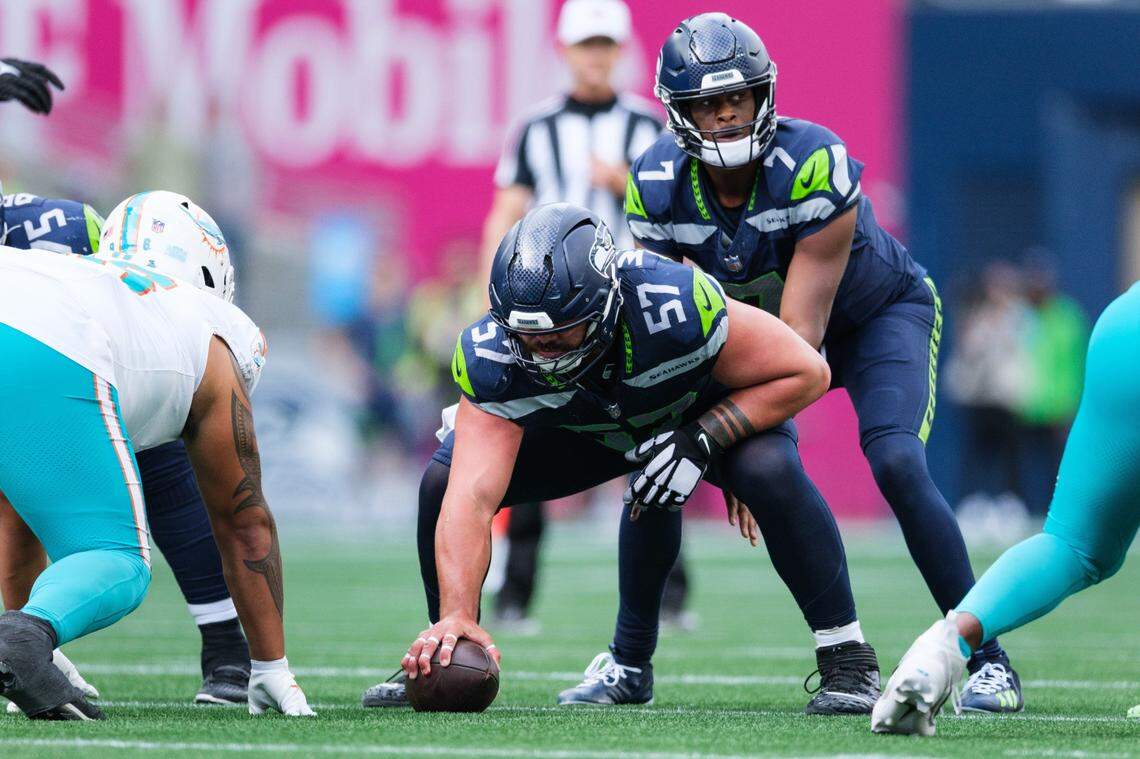 Sep 22, 2024; Seattle, Washington, USA; Seattle Seahawks center Connor Williams (57) prepares to snap the ball during the fourth quarter against the Miami Dolphins at Lumen Field. Mandatory Credit: Kevin Ng-Imagn Images