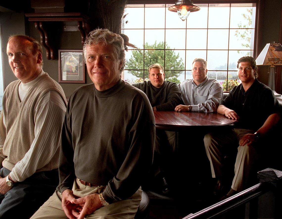 Jeff Iverson (left front) and Cal Chandler (right front) founded Ram International in 1971. They retired in 2001 and turned the business over to their sons, David Iverson, Jeff Iverson Jr. and Jeff Chandler (background from left). This photo was taken at the Tacoma Ram on Ruston Way on Sept. 27, 2001.