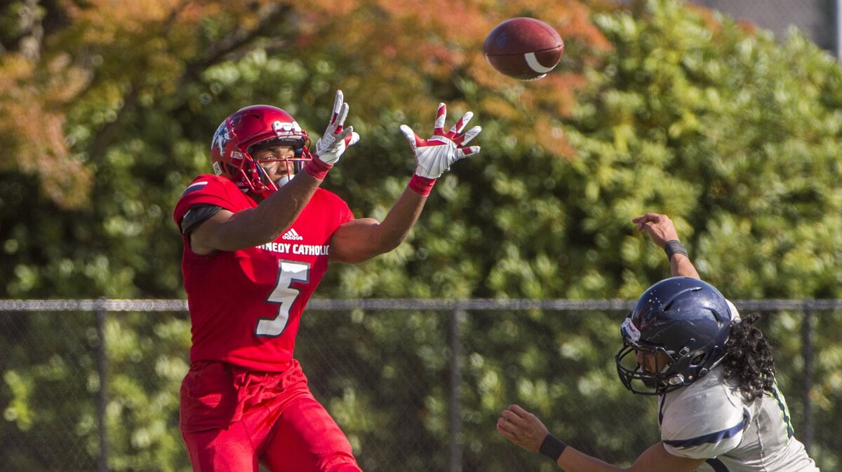 Justin Richard Baker of Kennedy Catholic High School snags another pass in a football game at Highline Memorial Stadium in Burien, October 6, 2018.  Kennedy Catholic beat Beamer 49-45.