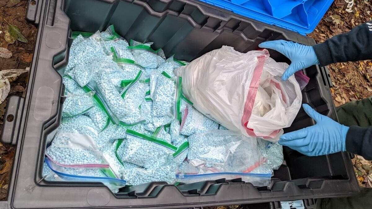 This image shows a box full of fentanyl pills seized by the FBI.