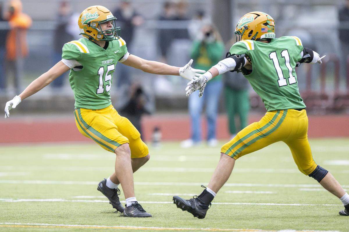 Tumwater’s Evan Baxter (15) and Tumwater’s Grady Wall (11) celebrate taking control of the ball from Franklin Pierce on Saturday, Nov. 22, 2025, in Tumwater.