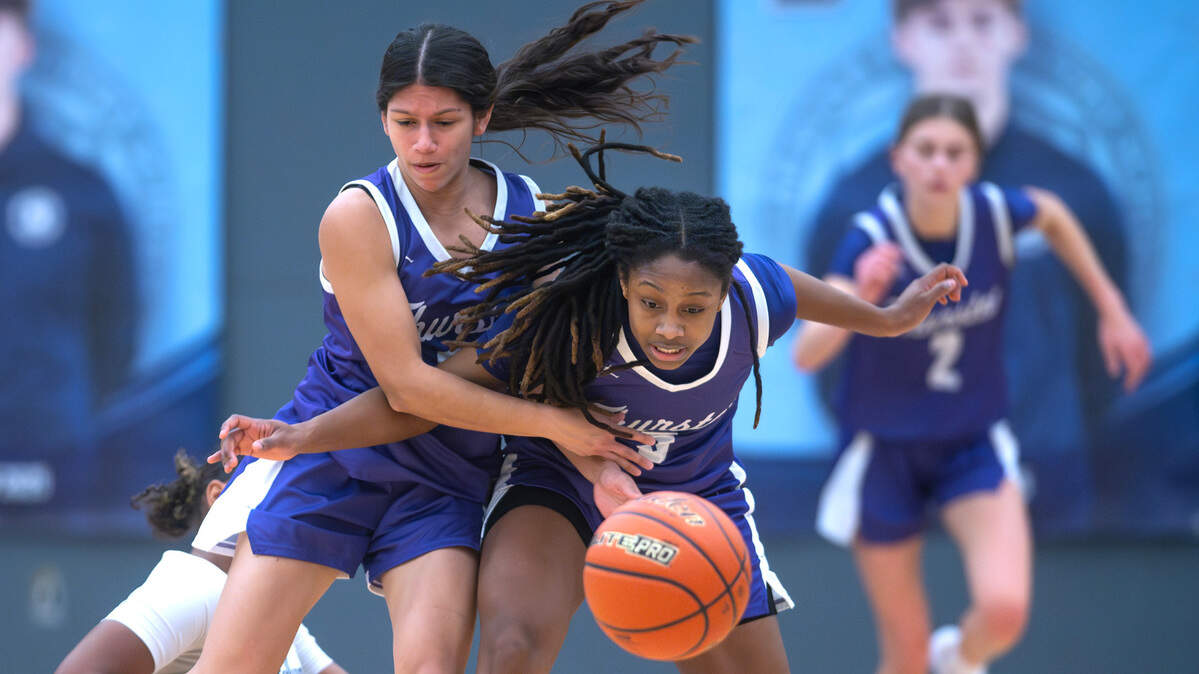 North Thurston’s Patricia Hope Egrubay (left) and teammate Soraya Ogaldez collide as they chase down a loose ball during Friday night’s girls basketball game against the Bellarmine Lions at Bellarmine Preparatory School in Tacoma, Washington, on Jan. 17, 2025.