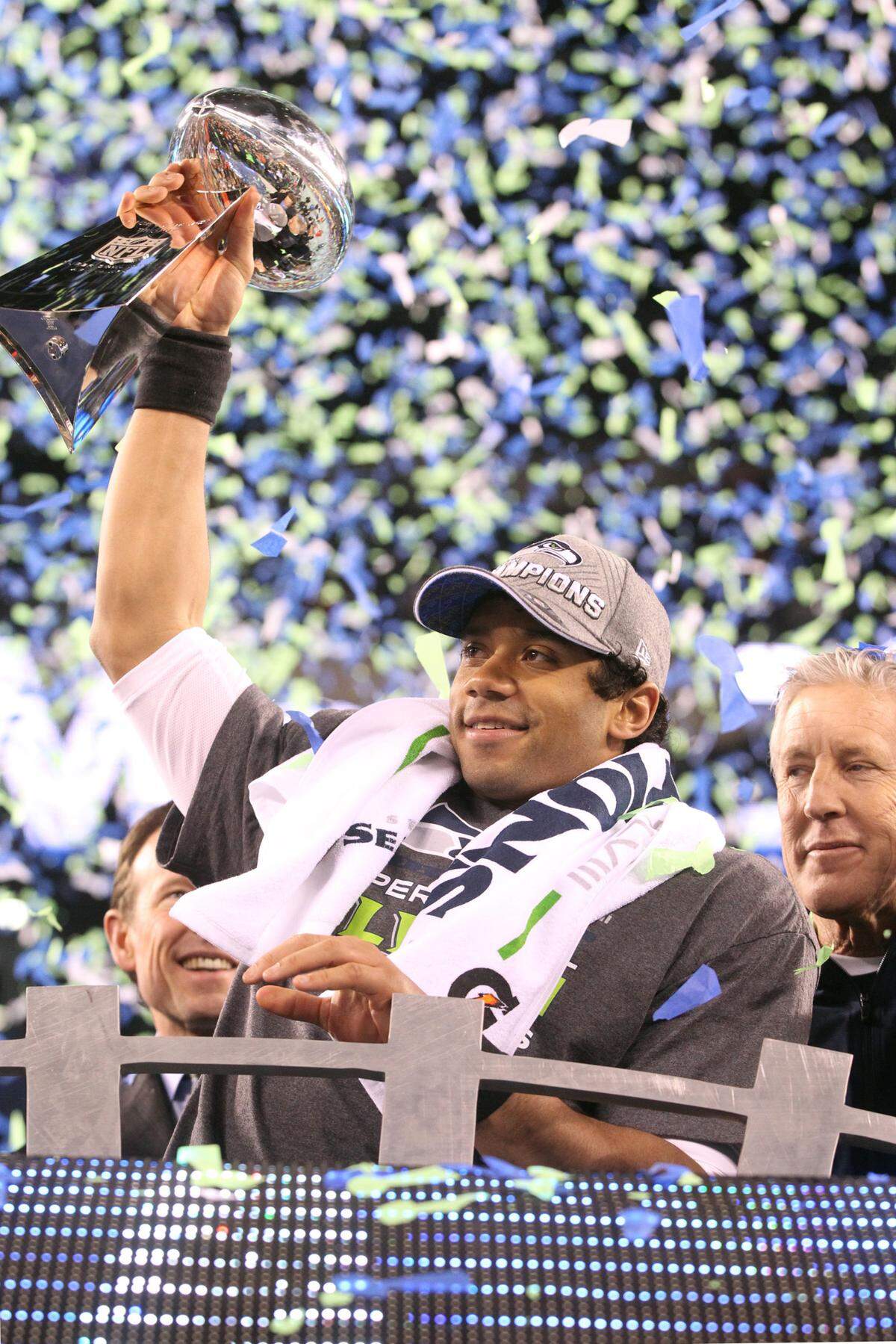 Seattle quarterback Russell Wilson raises the Vince Lombardi Trophy following the Seahawks 43-8 victory over the Denver Broncos in Super Bowl XLVII at MetLife Stadium in East Rutherford, NJ on Sunday, Feb. 2, 2014.