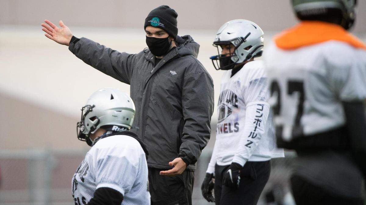 Coach Cameron Robak talks with players during practice at Spanaway Lake high school in Spanaway, Wash., on Monday, March 22, 2021.