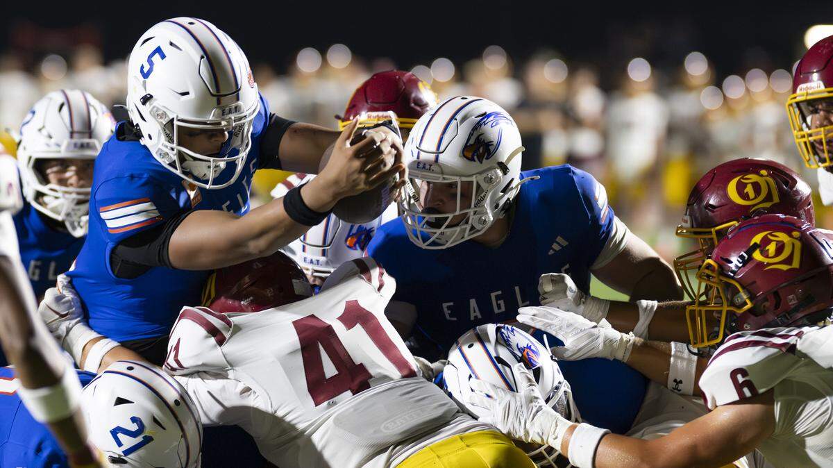 Graham-Kapowsin Eagles quarterback AJ Tuivaiave (5) reaches out for the short-yard touchdown over O’Dea Fighting Irish during the second half of the game at Art Crate Field, on Friday, Sept. 5, 2025, in Spanaway, Wash.