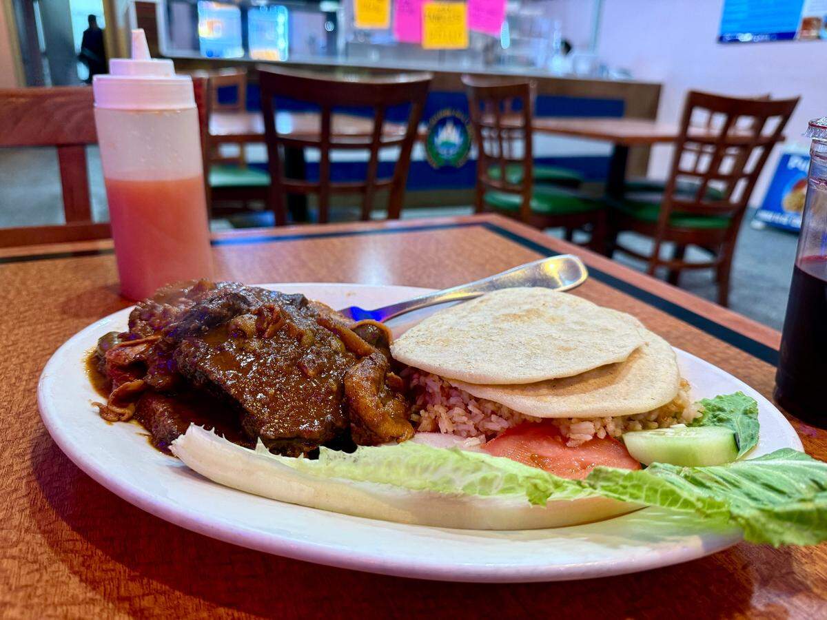 El Boqueron, a new Salvadoran bakery and cafe in Tacoma’s South End, serves pupusas and plates, including this beef, plum and pineapple specialty, carne horneada.
