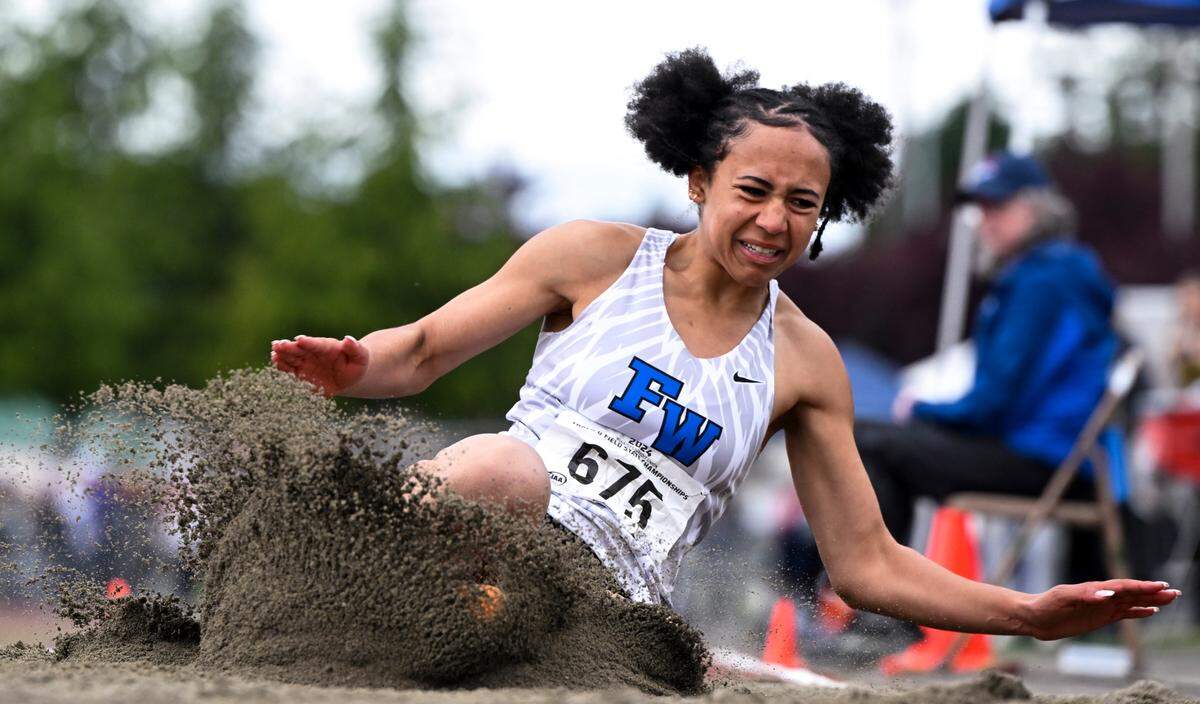 Federal Way’s Cassandra Atkins lands in the pit on the 4A competes in the 4A triple jump during day 2 of the Track and Field Championship at Mount Tahoma High School, on Friday, May 24, 2024, in Tacoma, Wash.