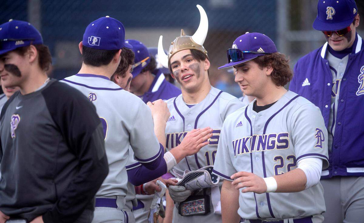 Puyallup’s Kai Halstead is welcomed by teammates after blasting a solo home run during Wednesday afternoon’s baseball game against the Olympia Bears at Olympia High School in Olympia, Washington, on April 12, 2023. Halstead went 3-4 with two home runs and four RBIs in Puyallup’s 6-2 victory.