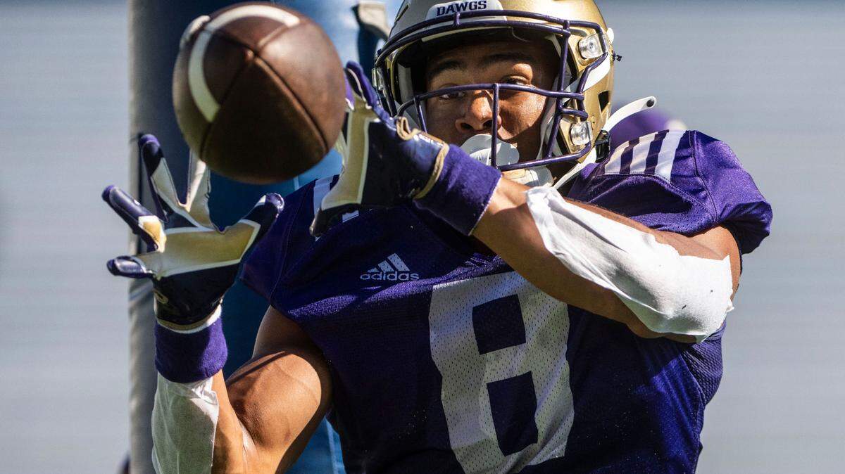 University of Washington Huskies running back Will Nixon, 8, catches the ball during a drill on the fourth day of Fall practice at Husky Stadium on Thursday, Aug. 7, 2022 in Seattle, Wash.