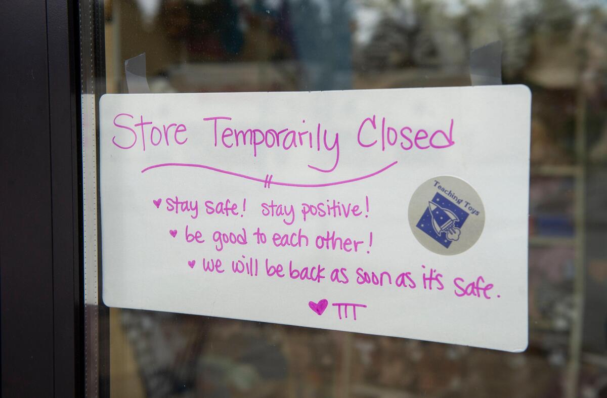 Every business shut down per the governor’s coronavirus closure order featured a personalized sign for customers near their entrance, like this one at Teaching Toys in the Uptown Gig Harbor shopping center Saturday, March 28, 2020.