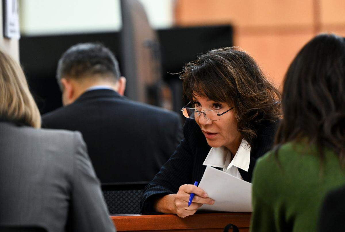 Special Assistant Attorney General Patty Eakes speaks with other state attorneys during the pre-trail motion in the trial of Tacoma Police Officers Christopher Burbank, Matthew Collins and Timothy Rankine in the killing of Manny Ellis at Pierce County Superior Court Monday, Sept. 18, 2023, Tacoma, Wash.