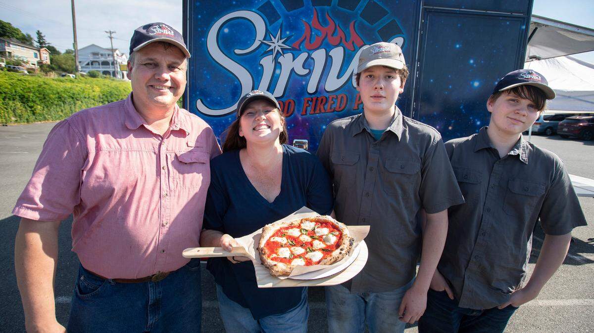 The Preble family (from left), Chuck, Holly, Charlie and William, run the Sirius Wood Fired Pizza truck, shown outside the North 47 Brewery in Browns Point on Tuesday, July 27, 2021.