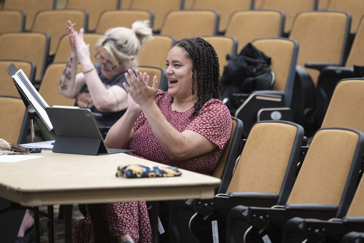 Amy Van Mechelen claps for a scene in Little Women during a rehearsal on Wednesday, June 3, 2026, at Tacoma Community College in Tacoma, Wash. Van Mechelen helped bring the first fully-staged production to TCC in more than 30 years.