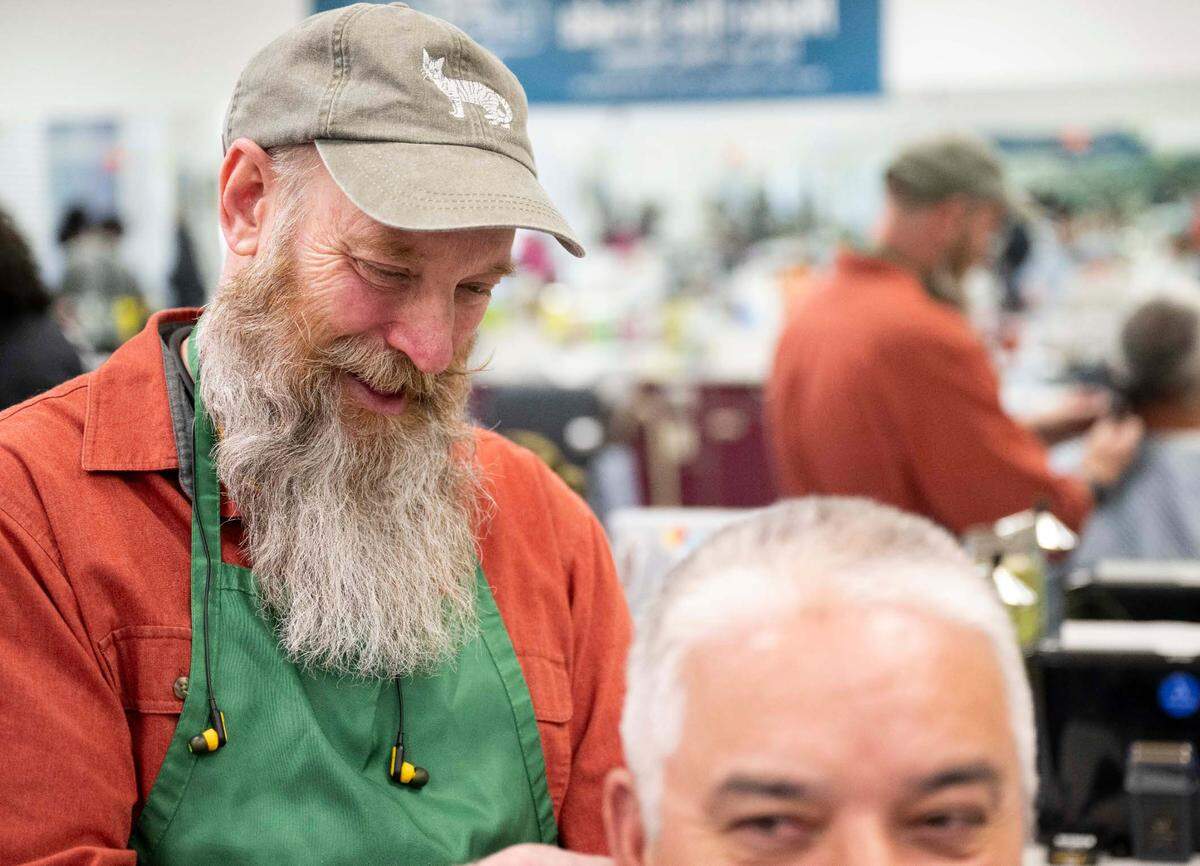 Student Roy Blanchard gives a trim and shave to client Ray Mendoza at Bates Barber Shop, part of the Bates Technical College barber program, on Tuesday, April 23, 2024, in Tacoma, Wash.