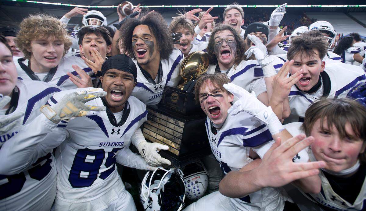 Sumner Spartans celebrate their state championship following their 27-24 victory over the Camas Papermakers in Saturday’s WIAA 4A state football championship game at Husky Stadium in Seattle, Washington, on Dec. 7, 2024. Sumner won the game on a last second field goal, 27-24.