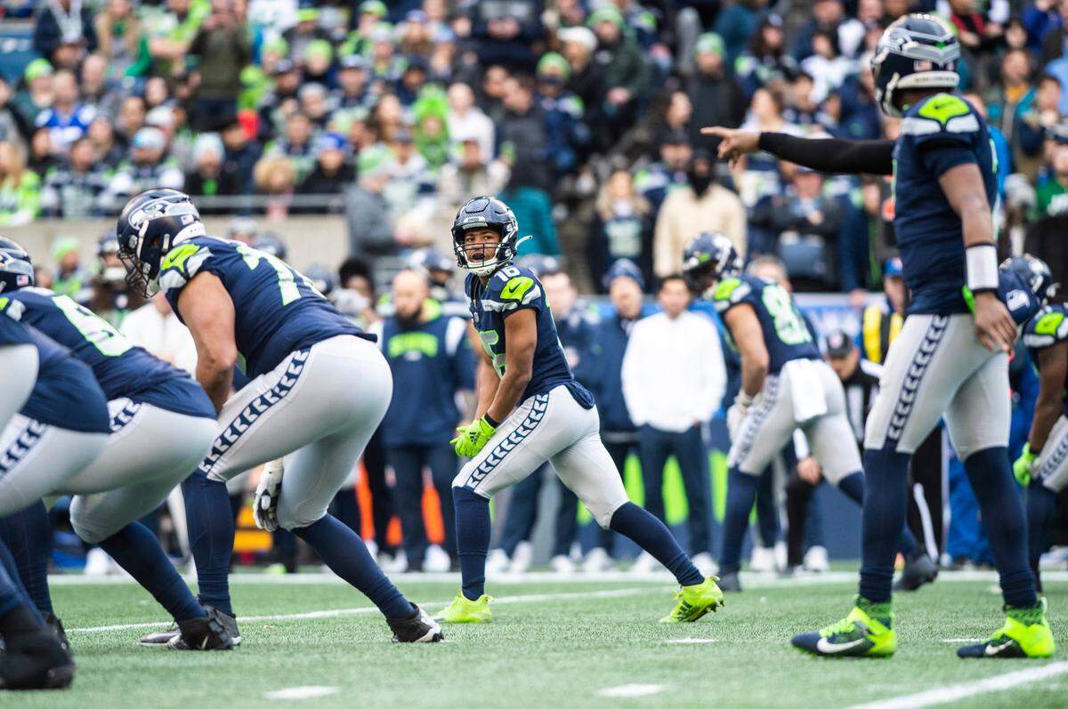 Seattle Seahawks wide receiver Tyler Lockett (16) watches Seattle Seahawks quarterback Geno Smith (7) call out a play during an NFL game against the Seattle Seahawks at Lumen Field in Seattle Wash. on Jan. 1, 2023. The Seahawks defeated the Jets 23-6.