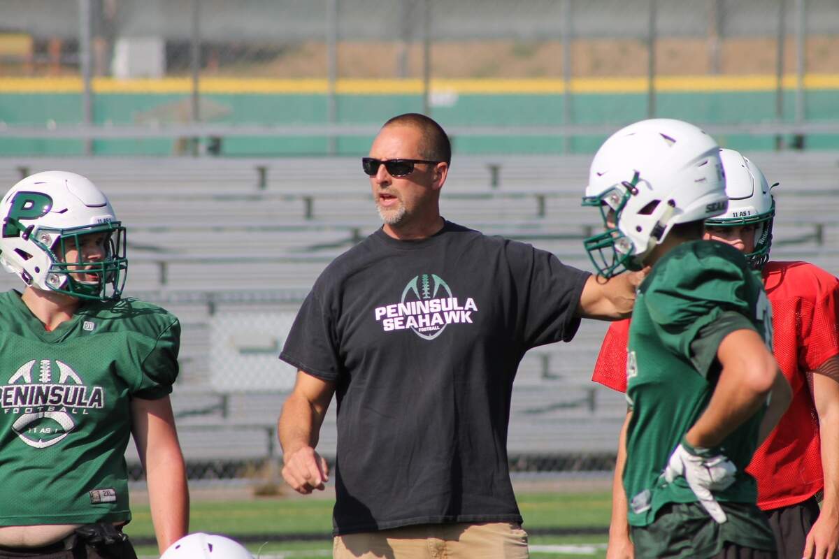 Peninsula coach Ross Filkins at practice on Thursday afternoon at Roy Anderson Field.
