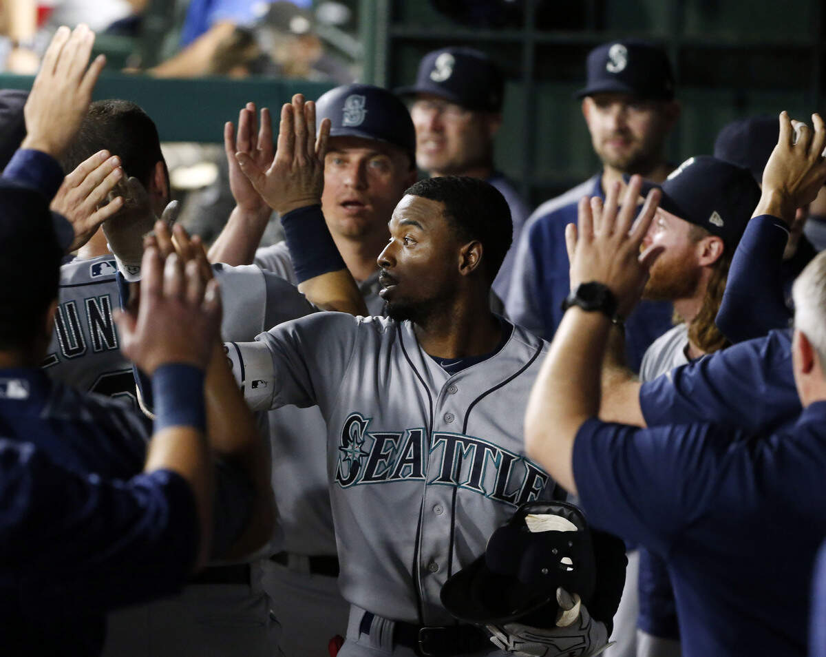 Seattle Mariners second baseman Dee Gordon (9) celebrates his home run against the Texas Rangers during the eighth inning of a baseball game Saturday, Sept. 22, 2018, in Arlington, Texas. (AP Photo/Michael Ainsworth)