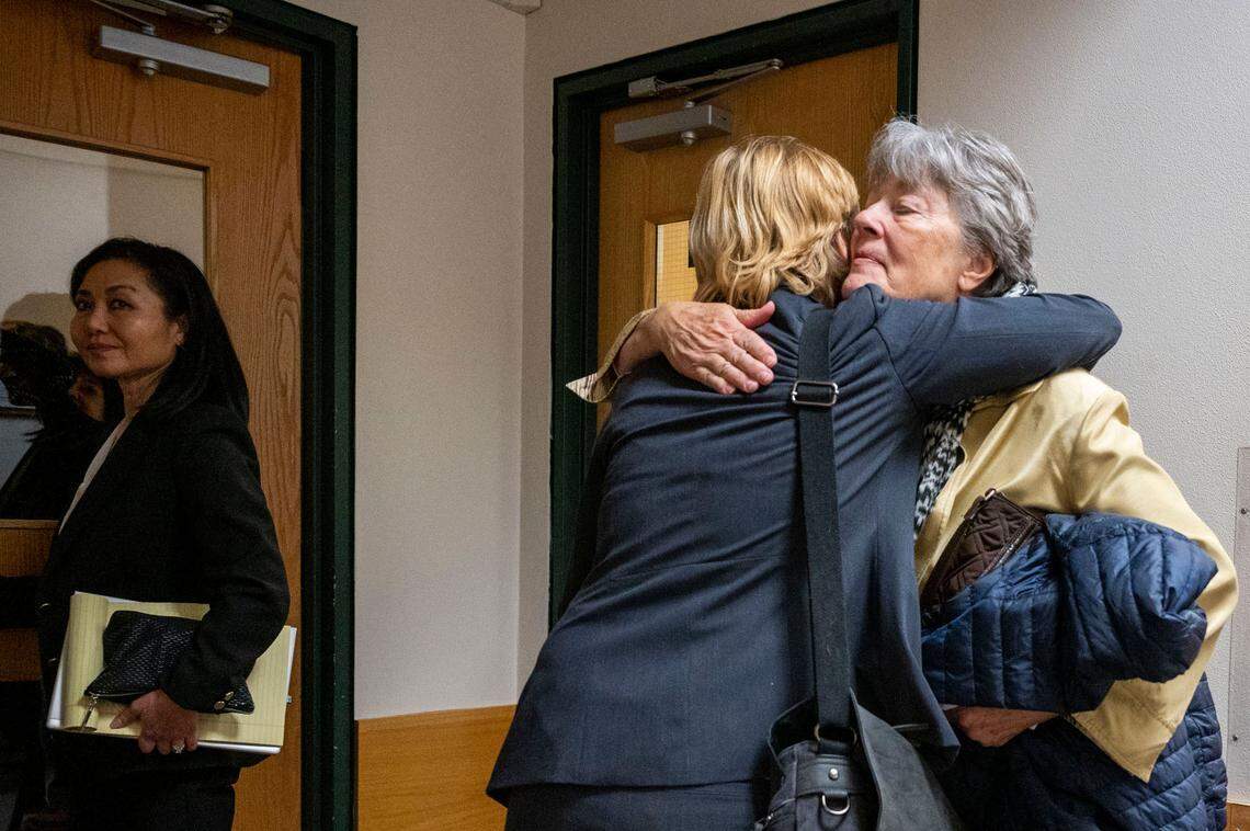 Pierce County Prosecutor Lisa Wagner hugs Barbara Leonard, the mother of Michella Welch, after Pierce County Superior Court Judge Stanley Rumbaugh sentenced Welch’s killer on Tuesday, March 22, 2022, in Tacoma, Wash. Gary Hartman, 70, was sentenced to prison for 26-and-a-half years, for the 1986 rape and murder of the 12-year-old Welch.