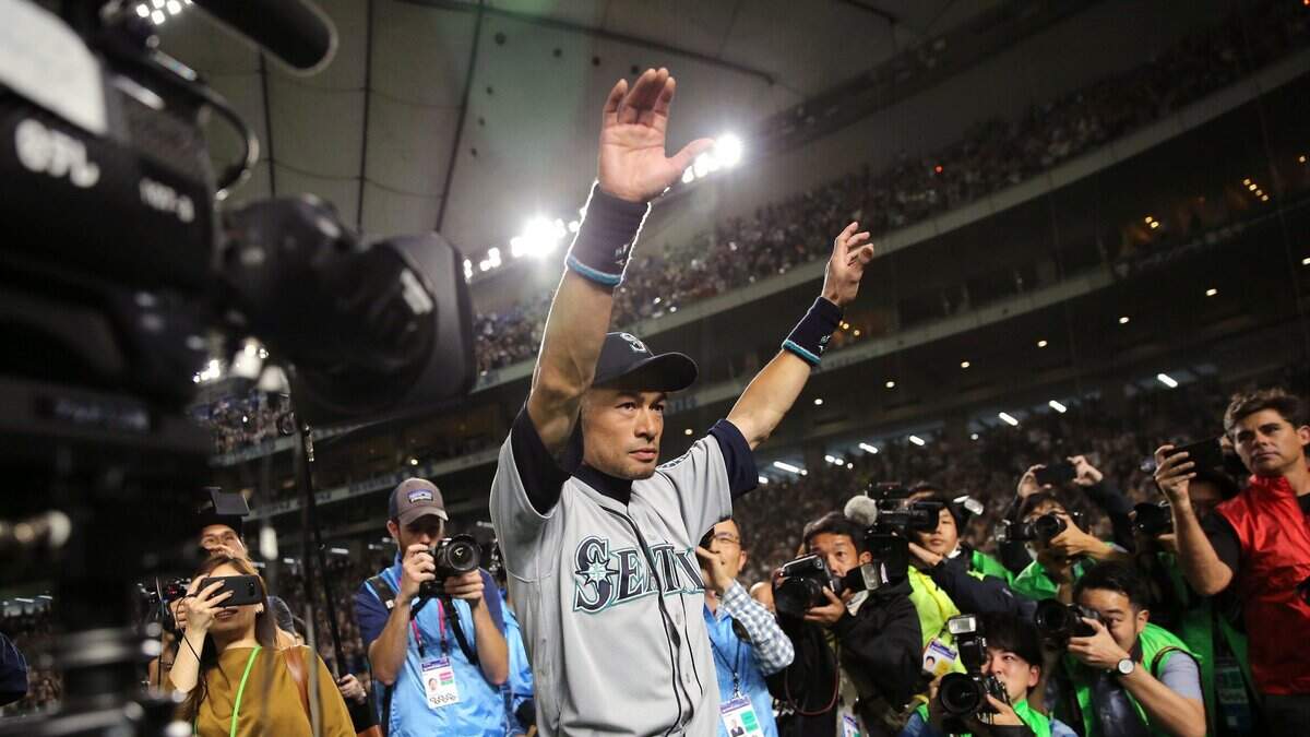Seattle Mariners right fielder Ichiro Suzuki waves to fans after returning to the field after Game 2 of the Major League baseball opening series against the Oakland Athletics at Tokyo Dome in Tokyo, Thursday, March 21, 2019. The 45-year-old Mariners star announced his retirement Thursday night, shortly after waving goodbye at the Dome. (AP Photo/Toru Takahashi)