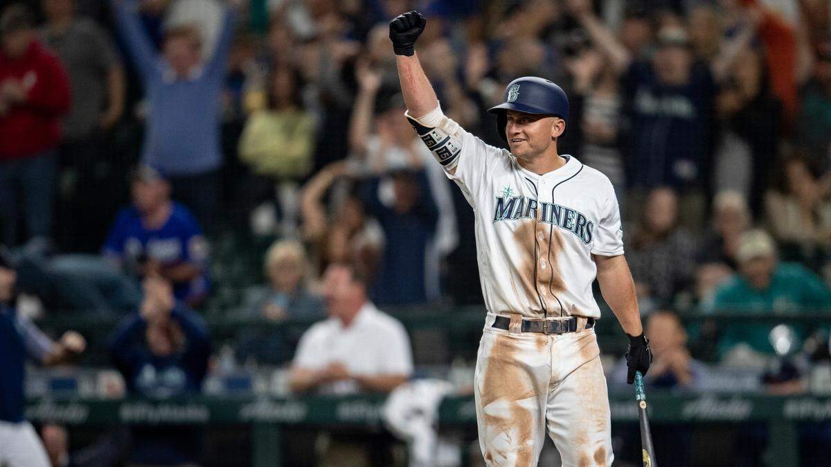 Seattle Mariners’ Kyle Seager reacts after a balk was called on Los Angeles Dodgers relief pitcher Dylan Floro allowing Cameron Maybin to score from third base during the tenth inning of a baseball game, Saturday, Aug. 18, 2018, in Seattle. The Mariners won 5-4 in 10 innings. (AP Photo/Stephen Brashear)