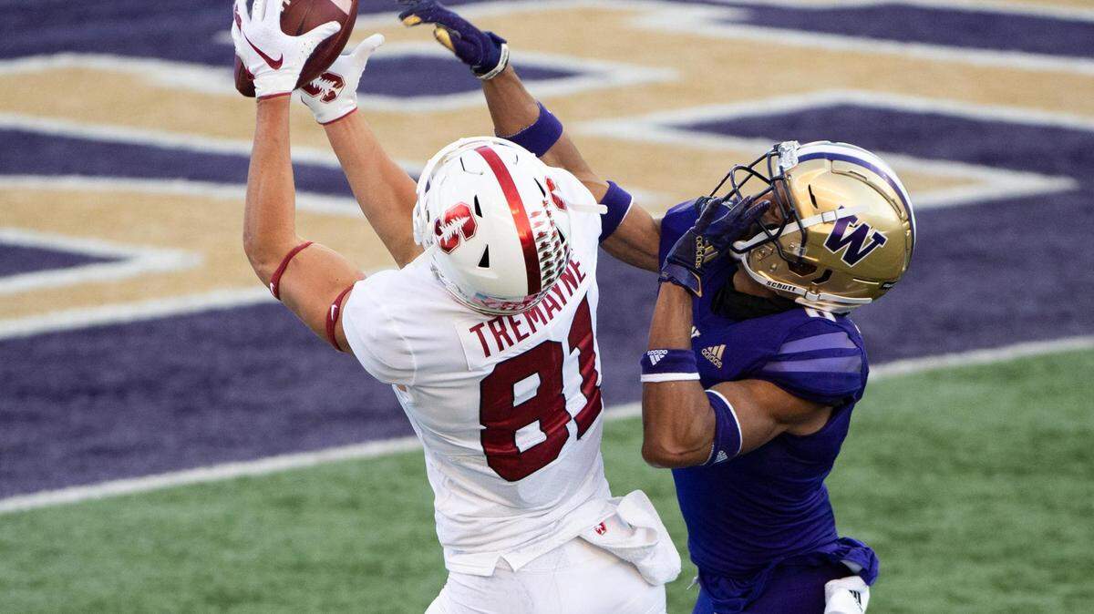 Stanford’s Brycen Tremayne makes a catch over Washington Huskies’ Keith Taylor in the third quarter. The Washington Huskies played the Stanford Cardinal in a PAC-12 football game at Husky Stadium in Seattle, Wash., on Saturday, Dec. 5, 2020.