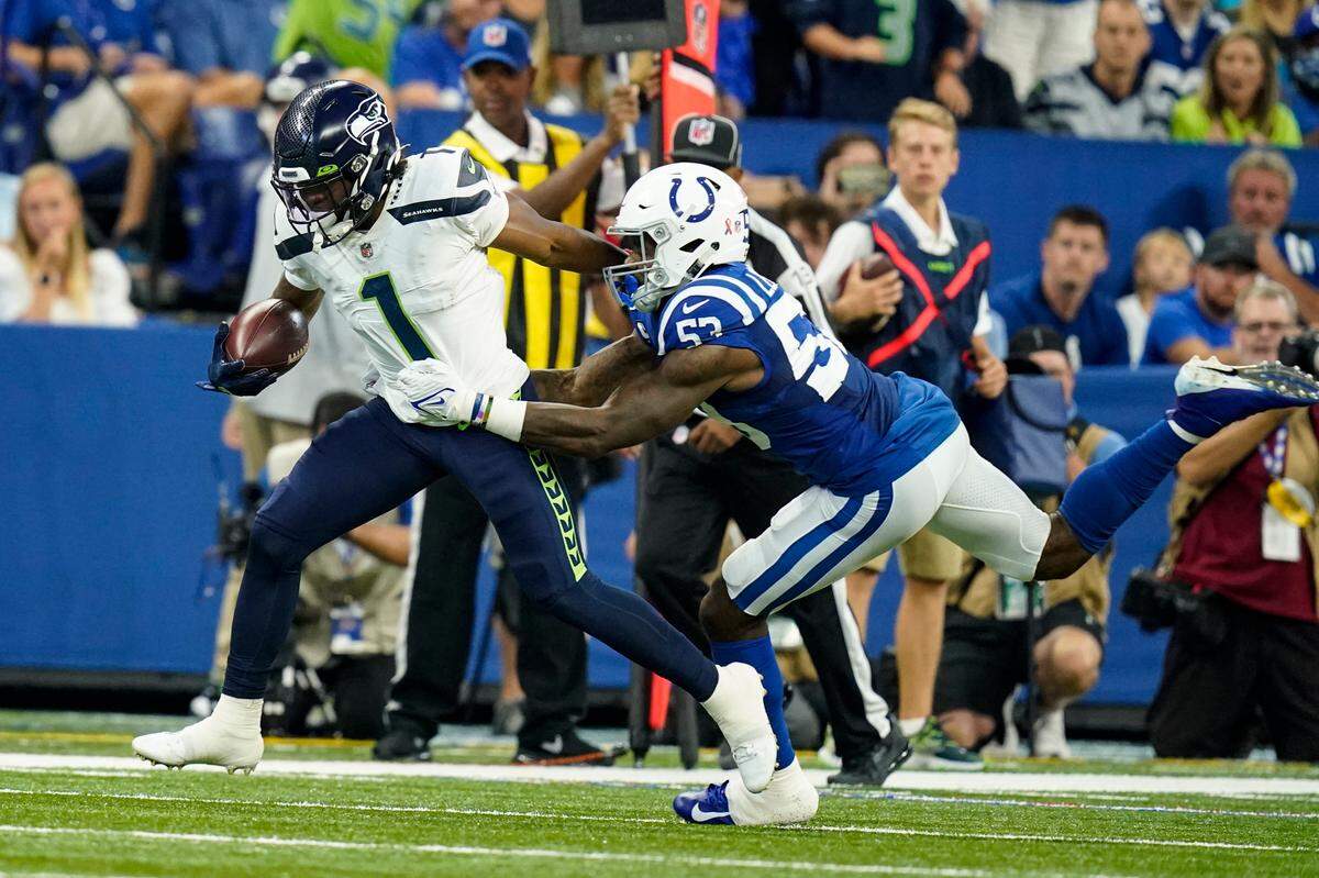 Seattle Seahawks wide receiver Dee Eskridge (1) is tackled by Indianapolis Colts outside linebacker Darius Leonard (53) in the first half of an NFL football game in Indianapolis, Sunday, Sept. 12, 2021. (AP Photo/Charlie Neibergall)