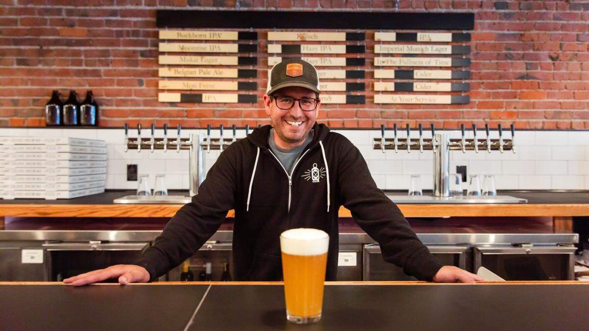 Vashon Island’s Camp Colvos Brewing opened a second taproom in downtown Tacoma at Brewery Blocks, serving draft beer, classic cocktails and New York-style pizzas whole and by the slice. Owner Matt Lawrence at the bar in June 2021.