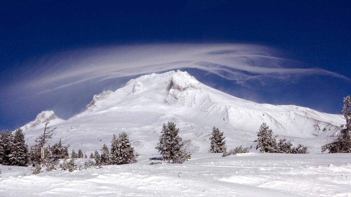 A 63-year-old man died Sunday morning after falling 500 feet while hiking Mount Hood, shown in 2009, with his son, Oregon officials say.