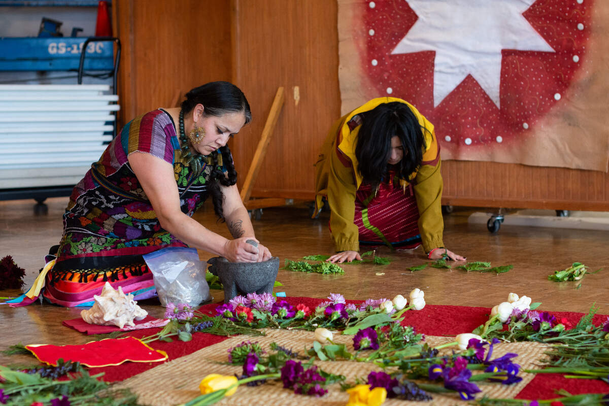 Ameyalteca Xochitemoani arranges medicine in the Mexica (Aztec) tradition to bring harmony, healing and good energy at the National Day for Awareness and Healing for Missing and Murdered Indigenous Women, People and Families Saturday, May 7, at Daybreak Star Indian Cultural Center in Seattle.