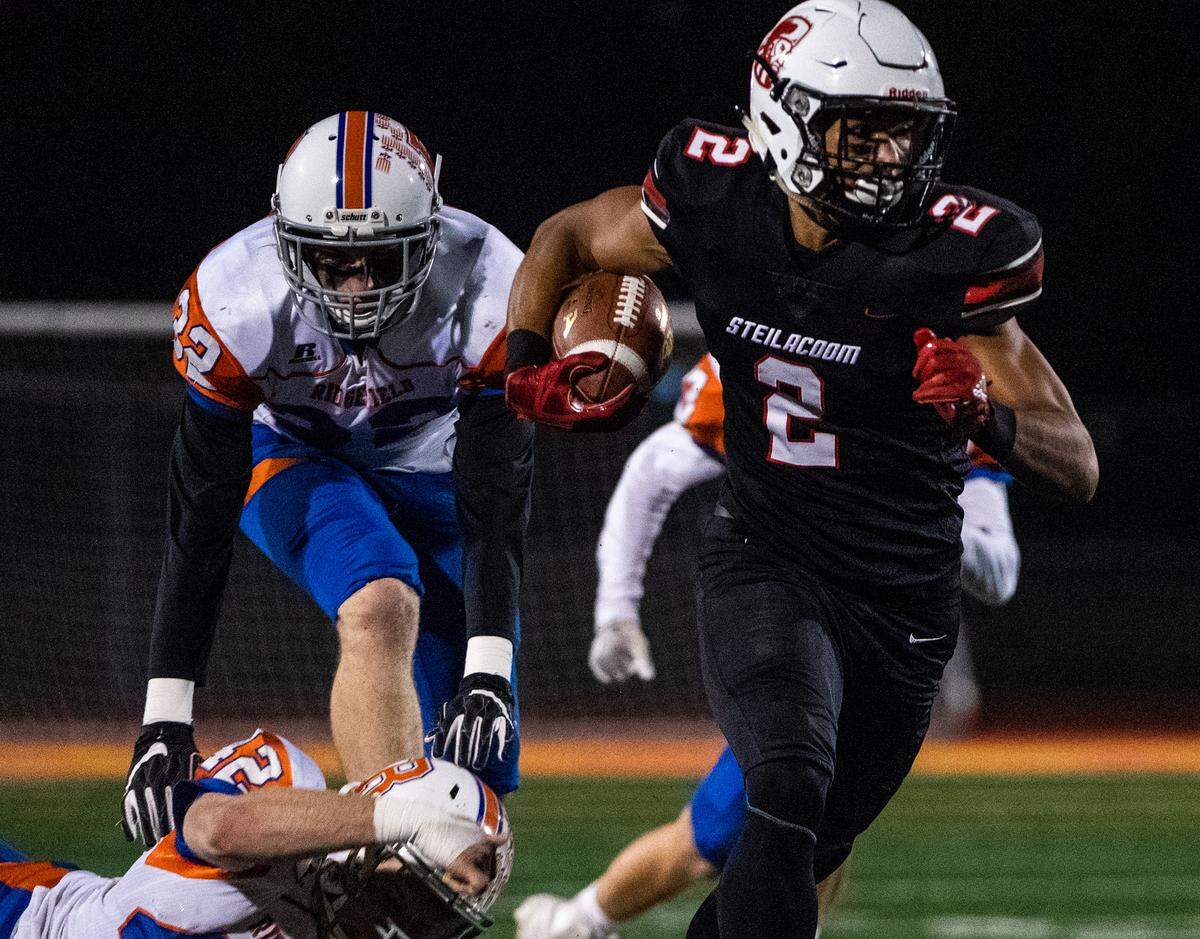 Steilacoom’s Emeka Egbuka returns a punt for a touchdown during the first quarter. Steilacoom played Ridgefield in a football game at Mount Tahoma High School in Tacoma, Wash., on Friday, Nov. 15, 2019.