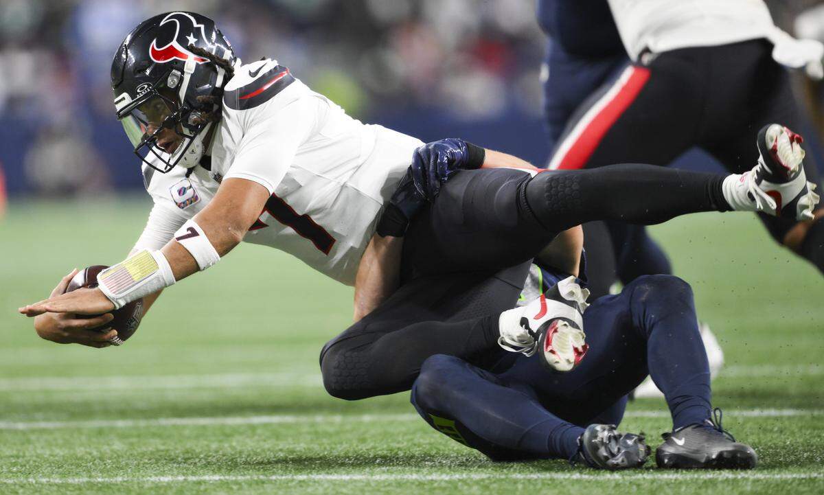 Seattle Seahawks safety Ty Okada (39) sacks Houston Texans quarterback C.J. Stroud (7) during the third quarter of the game at Lumen Field, on Monday, Oct. 20, 2025, in Seattle.