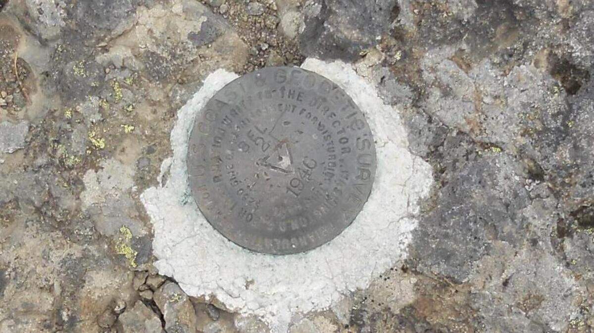 A bench mark at the top of 5,478-foot Mount Beljica near Ashford.