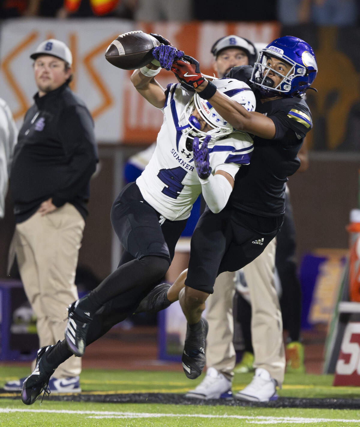 Sumner defensive back Izear Ferguson (4) breaks up a pass intended for Puyallup wide receiver J'Isaiah Mitchell (1) during the second half of the game at Sparks Stadium, on Saturday, Oct. 4, 2025, in Puyallup, Wash.
